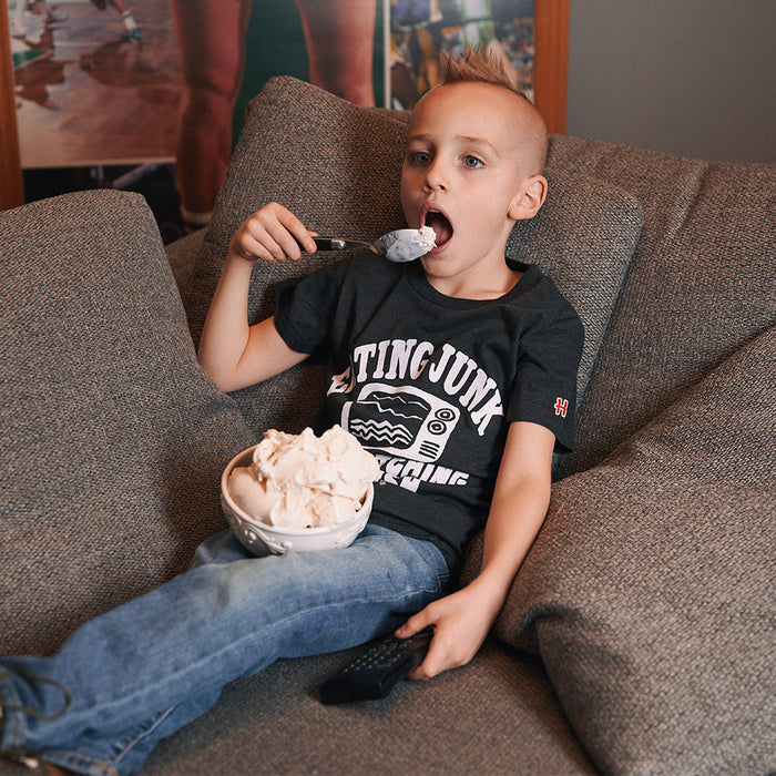 Youth Eating Junk And Watching Rubbish